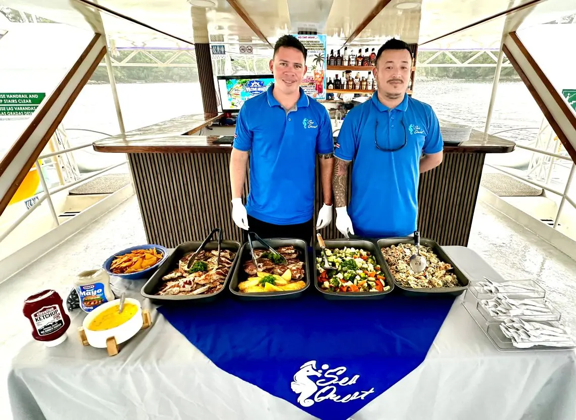 Sea Quest crew serving a meal on board